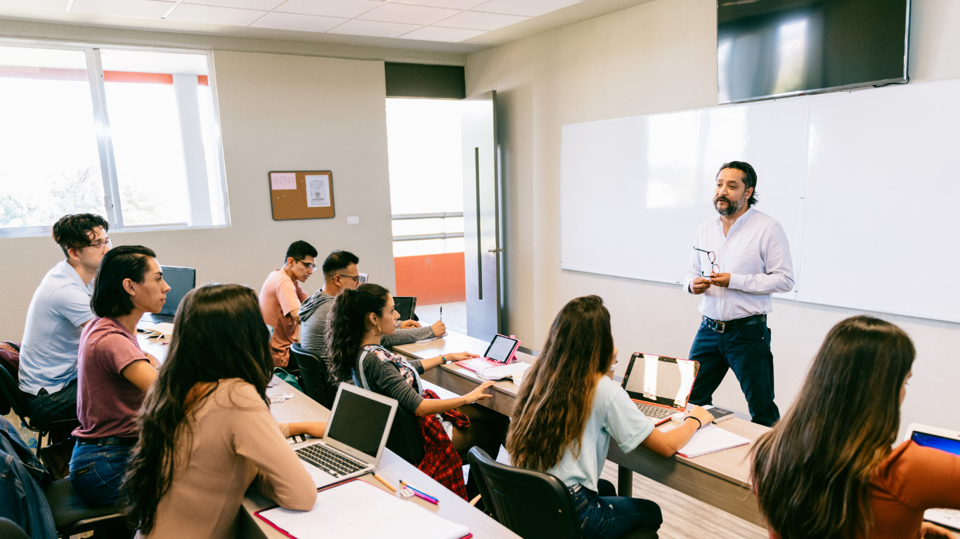 Students learning with a teacher in class
